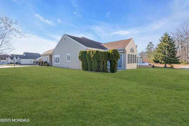 view of home's exterior featuring a yard