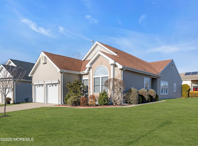 ranch-style house featuring a garage and a front yard