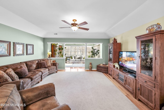 living room with lofted ceiling and ceiling fan