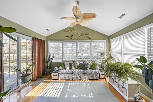 sunroom featuring ceiling fan and lofted ceiling