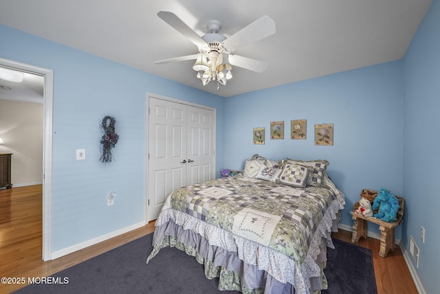 bedroom featuring a closet, ceiling fan, and hardwood / wood-style flooring