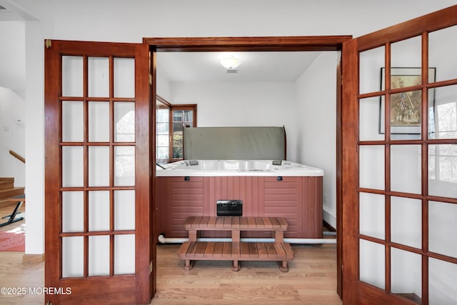 interior space featuring stairway and wood finished floors