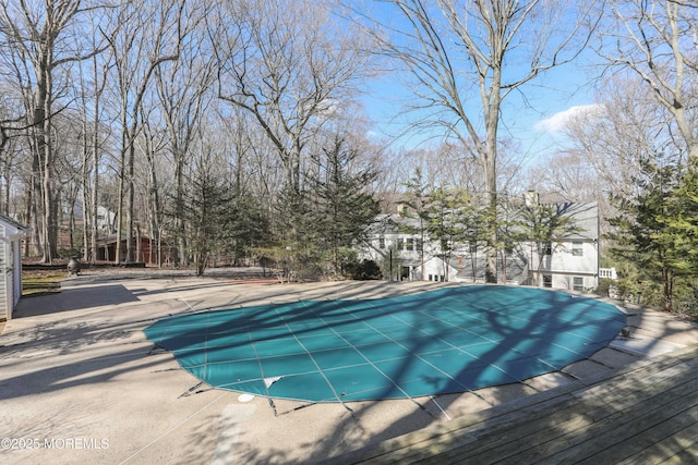 view of pool featuring a patio area and a covered pool