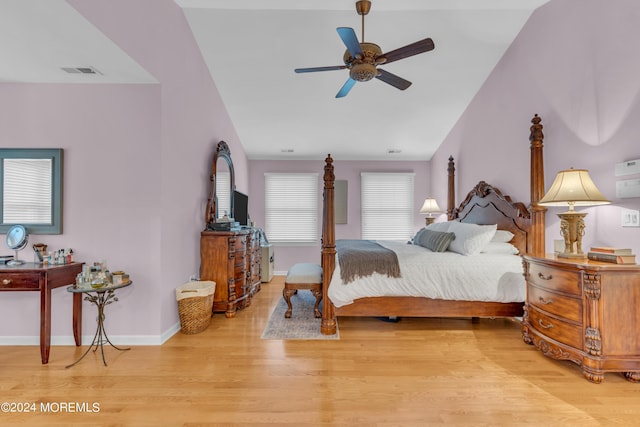 bedroom with vaulted ceiling, ceiling fan, and light hardwood / wood-style floors