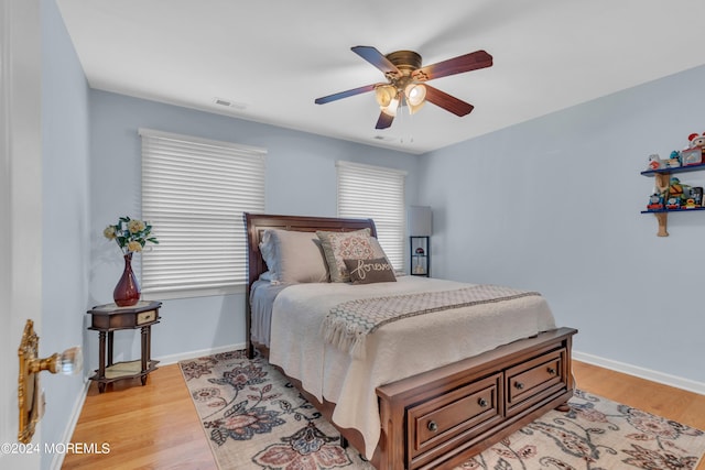 bedroom featuring ceiling fan and light hardwood / wood-style flooring