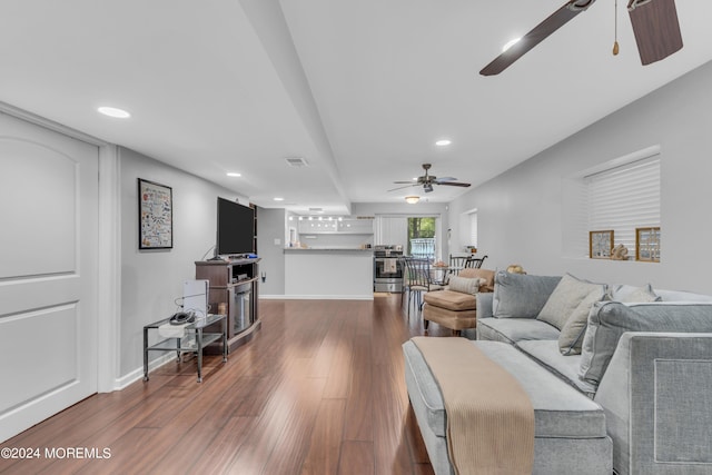 living room with hardwood / wood-style flooring and ceiling fan