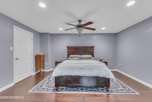 bedroom featuring dark wood-type flooring and ceiling fan