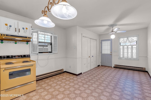 kitchen with white cabinets, electric stove, baseboard heating, and ceiling fan