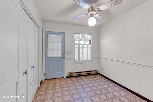 doorway featuring ceiling fan and baseboard heating