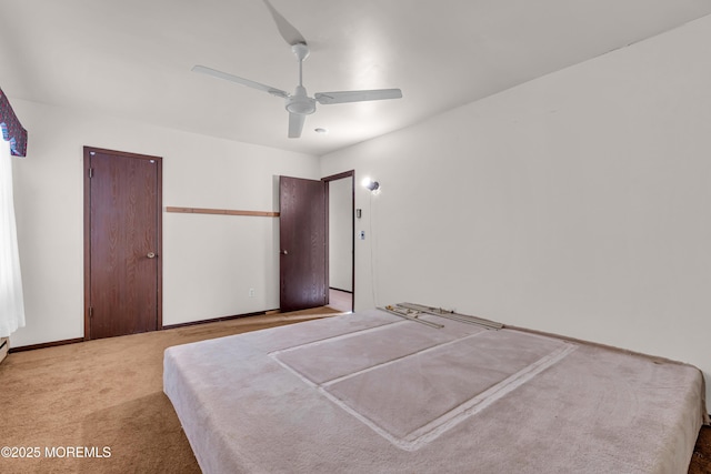 bedroom with ceiling fan and light carpet