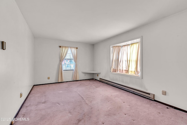 unfurnished room with baseboard heating and light carpet