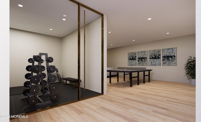 workout area featuring light wood-type flooring