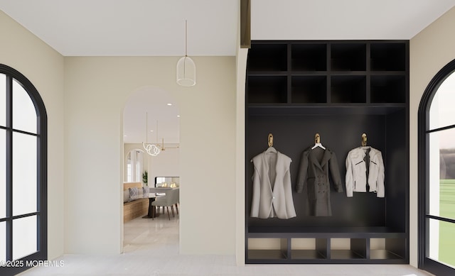 mudroom featuring a chandelier