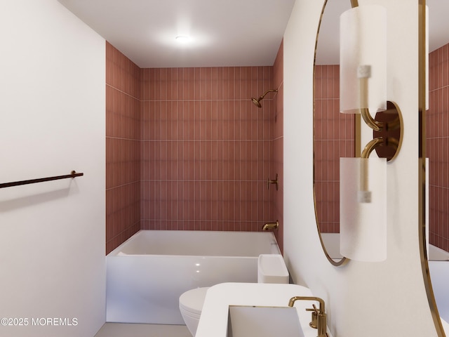 bathroom featuring toilet and tiled shower / bath