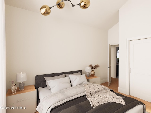 bedroom with hardwood / wood-style floors and high vaulted ceiling