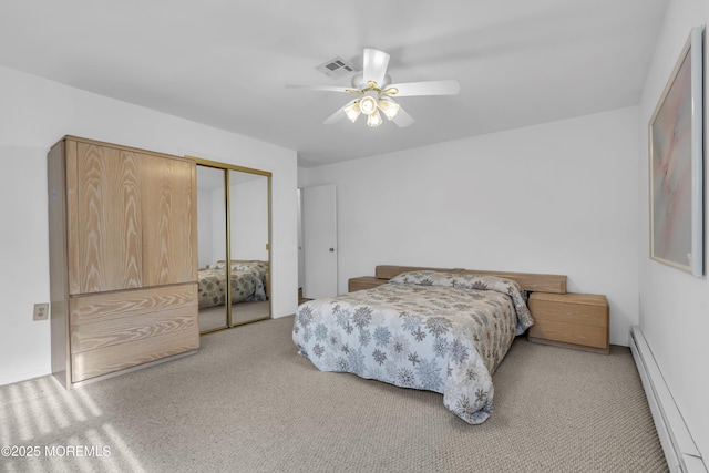 bedroom with ceiling fan, a baseboard radiator, light colored carpet, and a closet