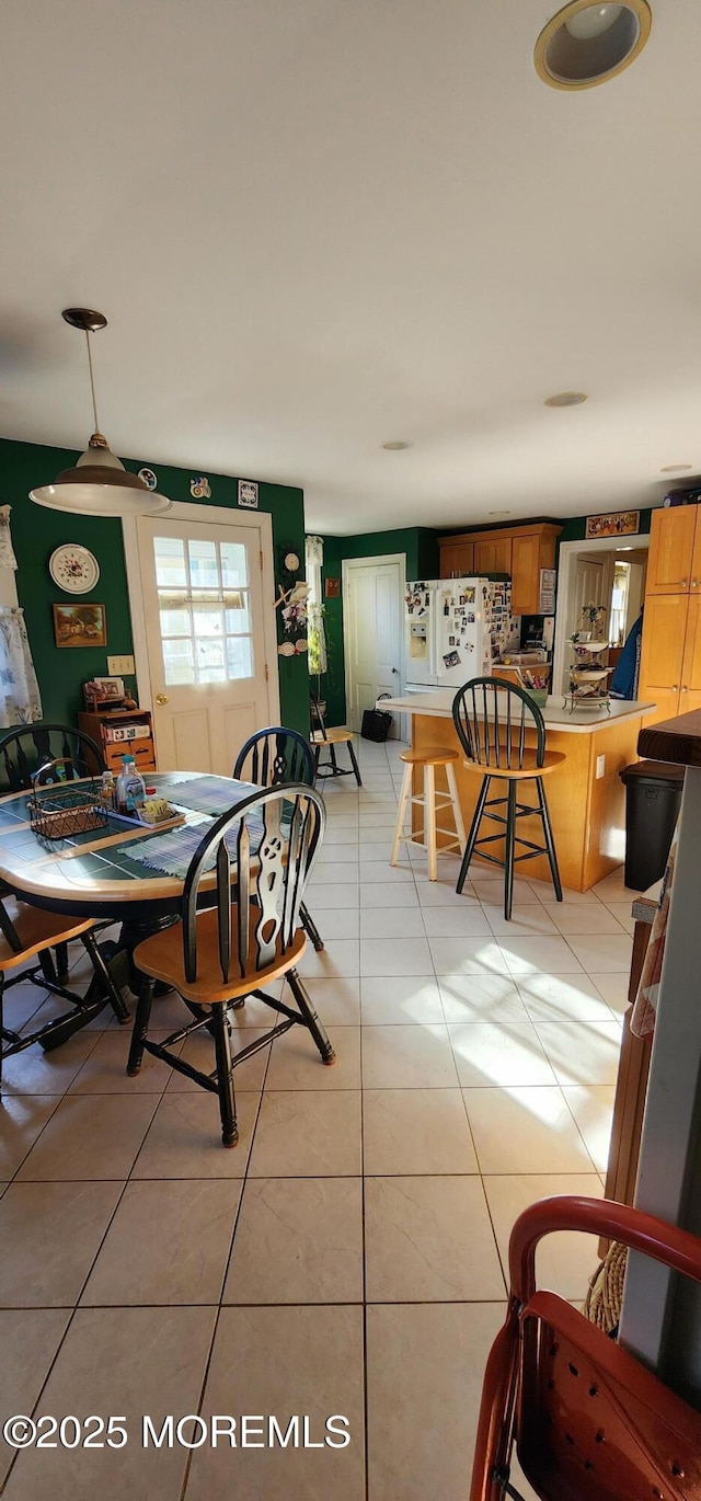 dining area with light tile patterned flooring