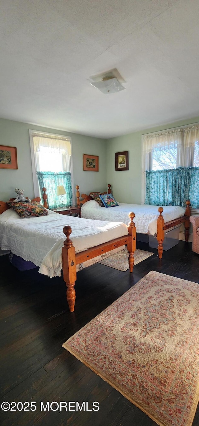 bedroom featuring dark hardwood / wood-style floors