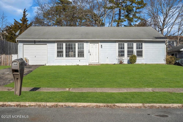 ranch-style house featuring a front lawn and a garage