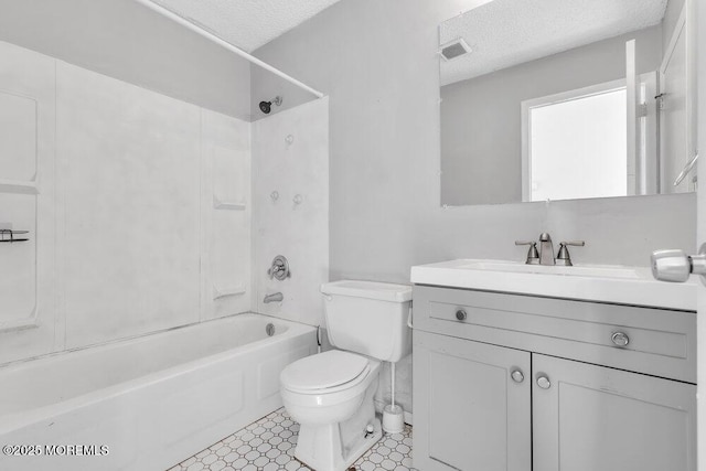 full bathroom featuring a textured ceiling, shower / tub combination, vanity, and toilet