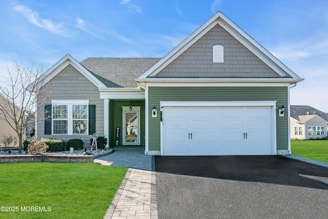 view of front facade with a garage and a front yard