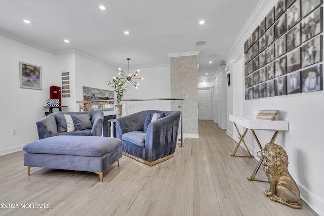 living room featuring a chandelier, light wood-type flooring, and ornamental molding