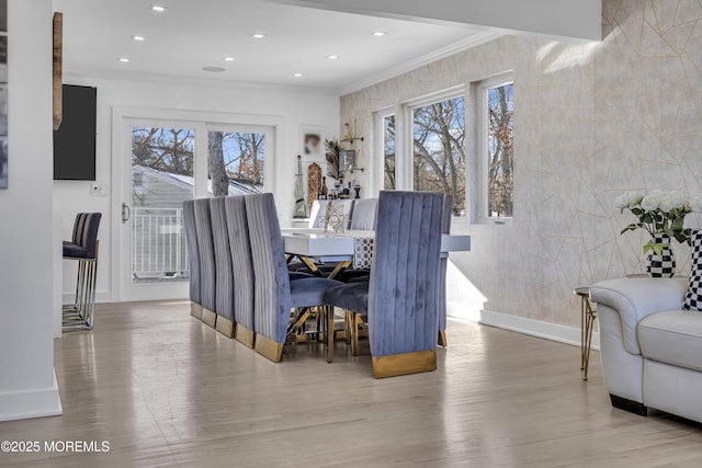 dining room featuring hardwood / wood-style floors and ornamental molding