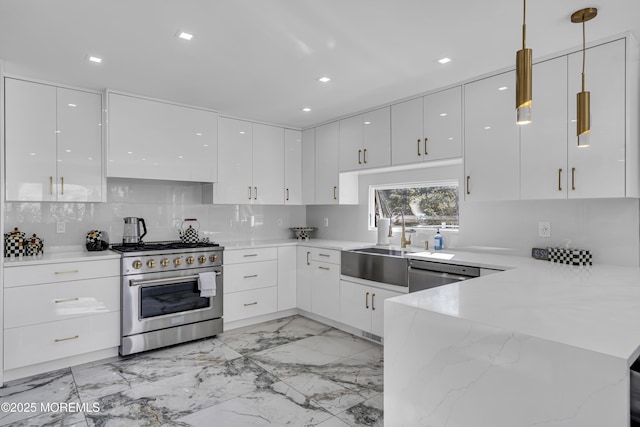 kitchen featuring kitchen peninsula, stainless steel appliances, sink, decorative light fixtures, and white cabinets