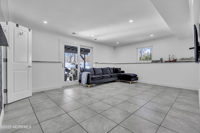 living room featuring light tile patterned floors and crown molding