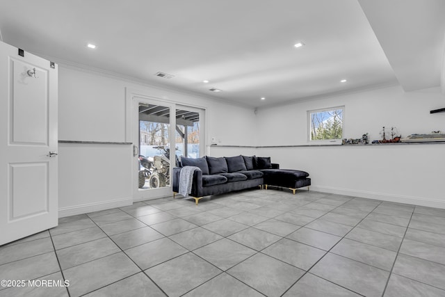 tiled living room featuring ornamental molding