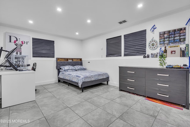 bedroom with light tile patterned flooring and washer / clothes dryer