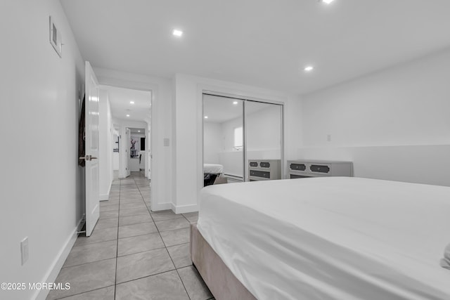 tiled bedroom featuring a closet