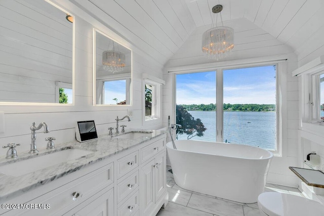 bathroom with wooden ceiling, a tub, a chandelier, a water view, and lofted ceiling