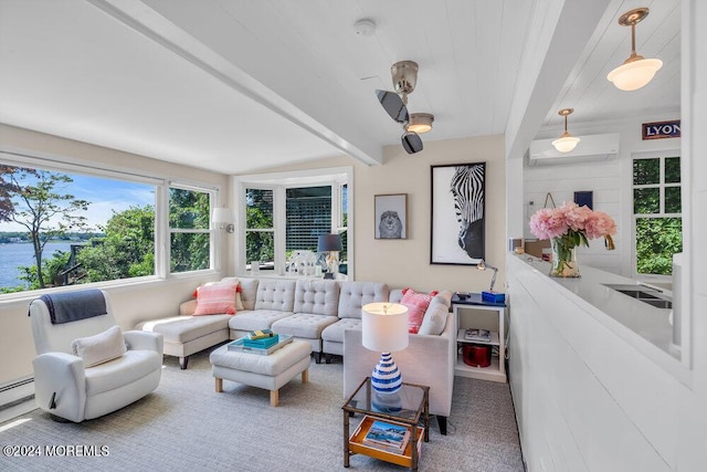 living room with carpet floors and an AC wall unit