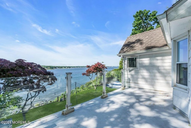 view of patio featuring a water view