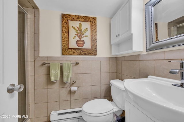 bathroom featuring vanity, tile walls, toilet, a shower with door, and a baseboard radiator