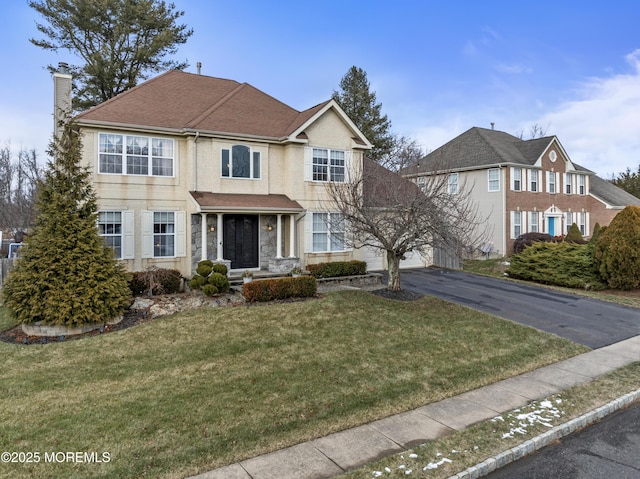 view of front facade with a front yard