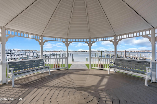 exterior space featuring a gazebo and a water view