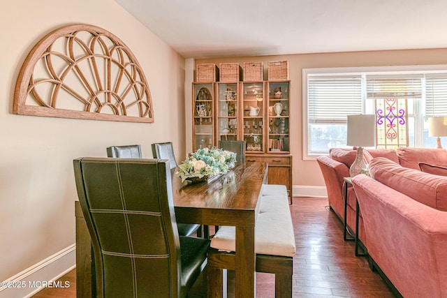 dining area with dark hardwood / wood-style flooring