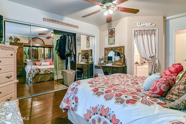 bedroom with ceiling fan, a closet, and dark hardwood / wood-style floors