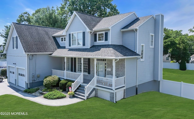 view of front of property featuring a garage, covered porch, and a front lawn