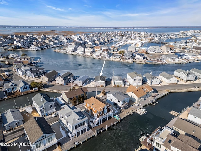 drone / aerial view with a water view