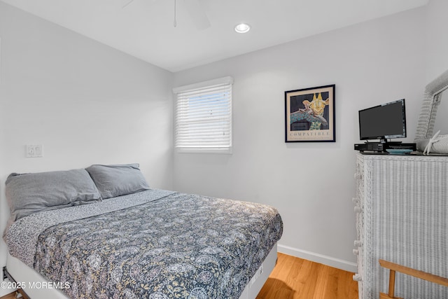 bedroom featuring hardwood / wood-style floors and ceiling fan