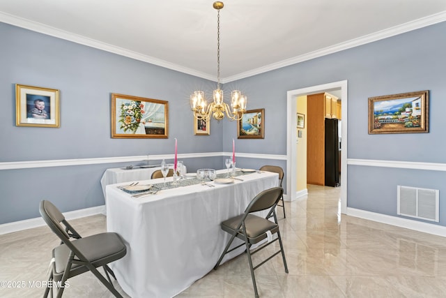 dining room with a notable chandelier and ornamental molding