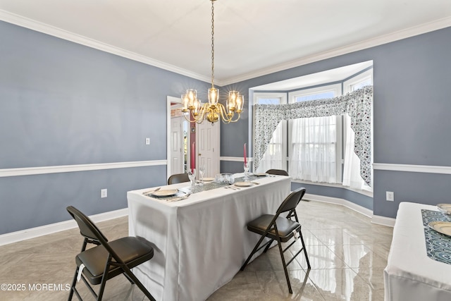 dining space with ornamental molding and a chandelier