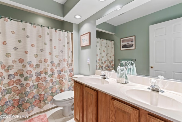 bathroom with toilet, tile patterned flooring, and vanity