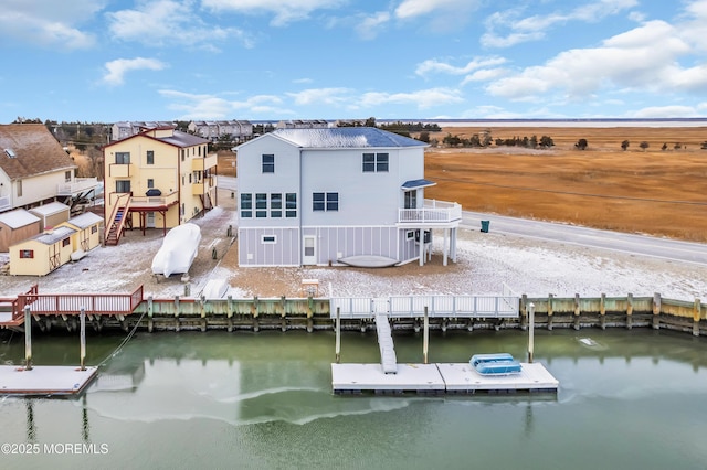 back of house with a water view