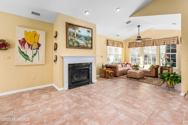 tiled living room with lofted ceiling, ceiling fan, and a fireplace