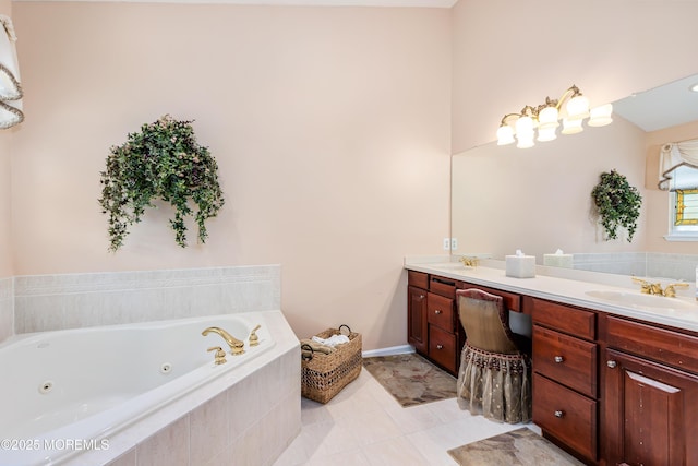 bathroom featuring tiled bath, vanity, and tile patterned flooring