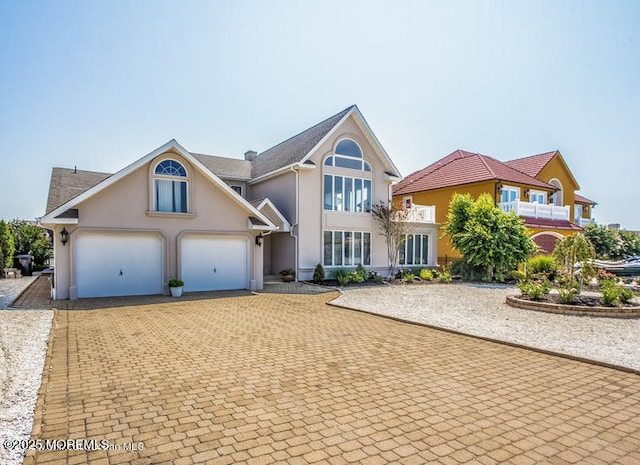 front facade with a garage